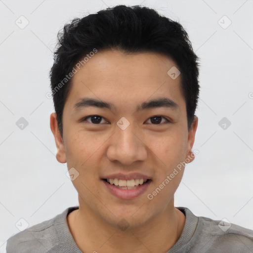 Joyful asian young-adult male with short  black hair and brown eyes