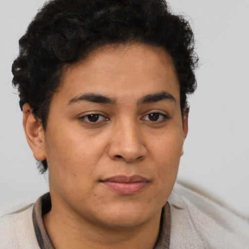 Joyful latino young-adult female with short  brown hair and brown eyes