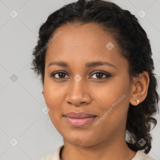 Joyful black young-adult female with medium  brown hair and brown eyes