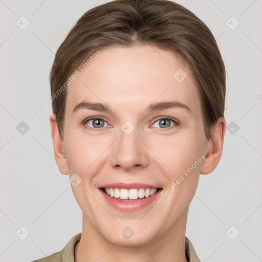 Joyful white young-adult female with short  brown hair and grey eyes