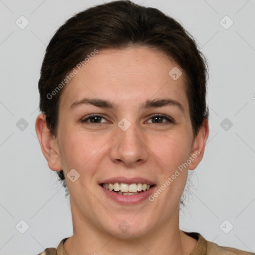 Joyful white young-adult female with short  brown hair and grey eyes