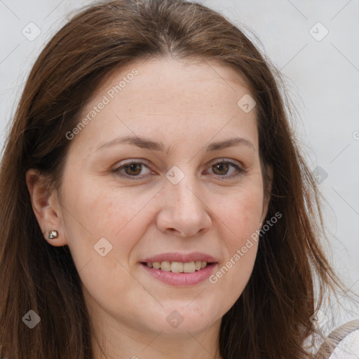 Joyful white adult female with long  brown hair and brown eyes