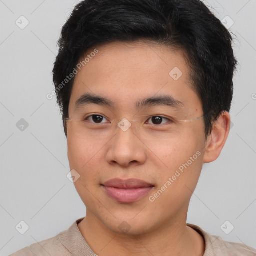 Joyful asian young-adult male with short  brown hair and brown eyes