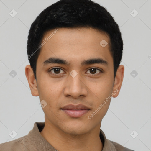 Joyful latino young-adult male with short  black hair and brown eyes