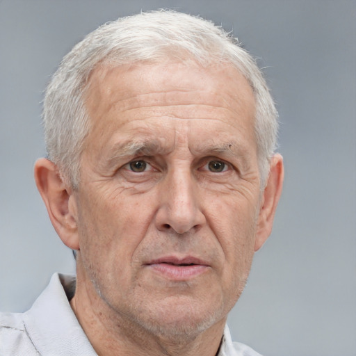 Neutral white middle-aged male with short  gray hair and brown eyes