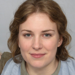 Joyful white young-adult female with medium  brown hair and blue eyes