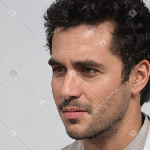 Neutral white young-adult male with short  black hair and brown eyes