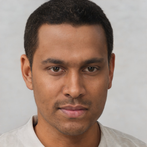 Neutral black young-adult male with short  brown hair and brown eyes