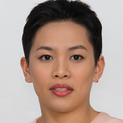 Joyful asian young-adult female with short  brown hair and brown eyes