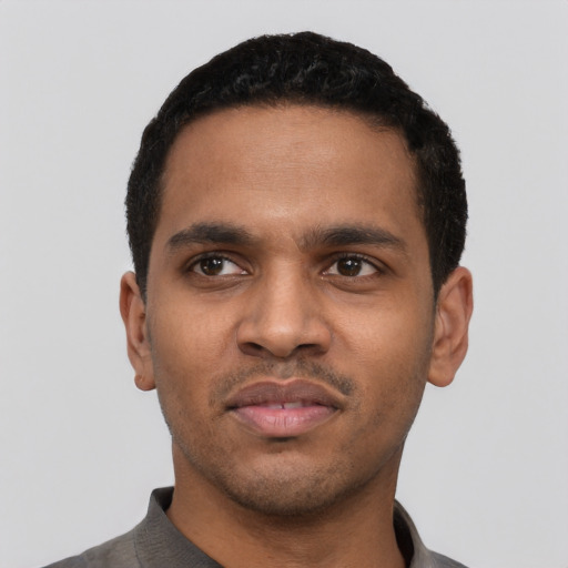 Neutral black young-adult male with short  black hair and brown eyes