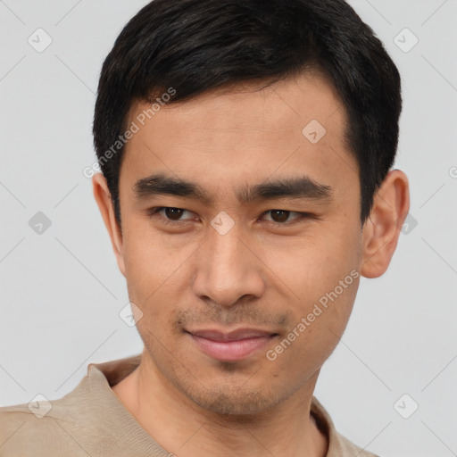 Joyful latino young-adult male with short  brown hair and brown eyes