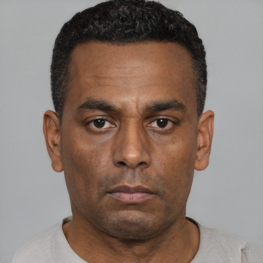 Neutral black adult male with short  black hair and brown eyes