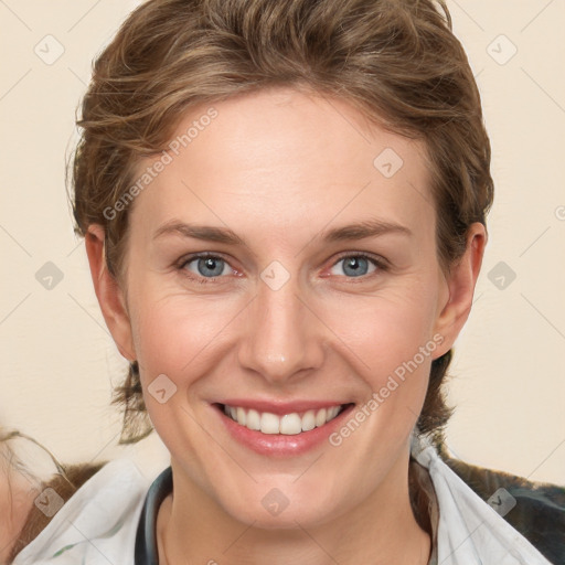 Joyful white young-adult female with medium  brown hair and blue eyes