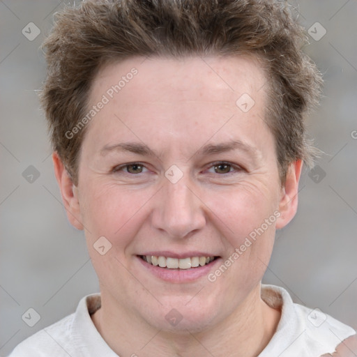 Joyful white adult female with short  brown hair and brown eyes