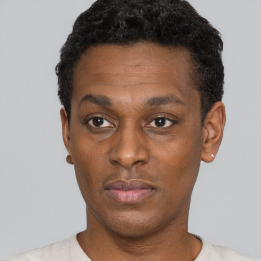 Neutral black young-adult male with short  black hair and brown eyes