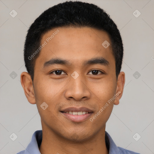 Joyful latino young-adult male with short  black hair and brown eyes