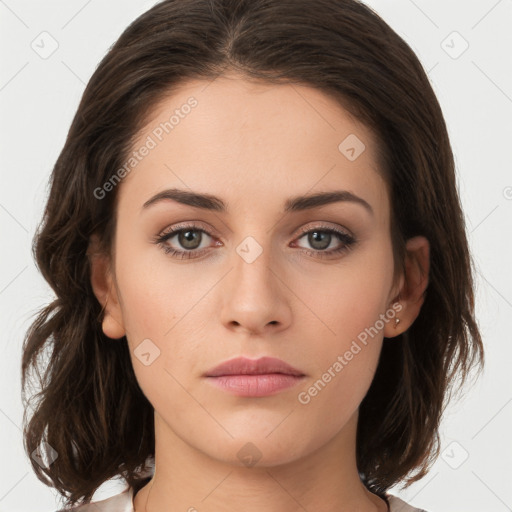 Neutral white young-adult female with medium  brown hair and brown eyes