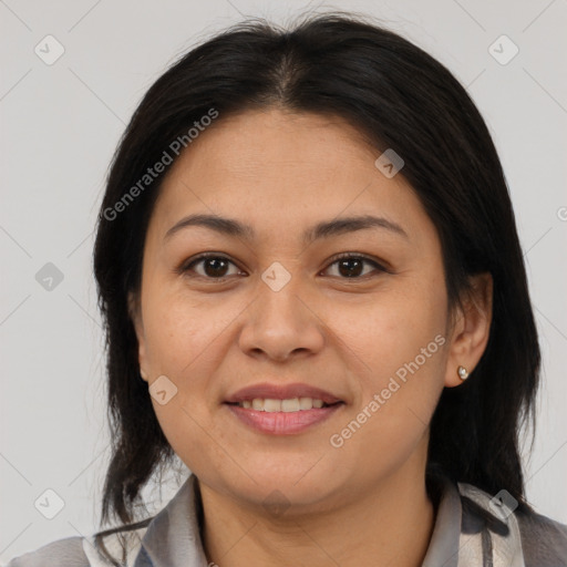 Joyful latino young-adult female with medium  brown hair and brown eyes