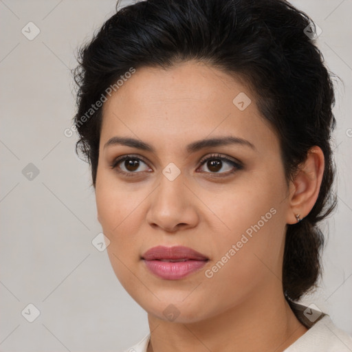Joyful latino young-adult female with medium  brown hair and brown eyes
