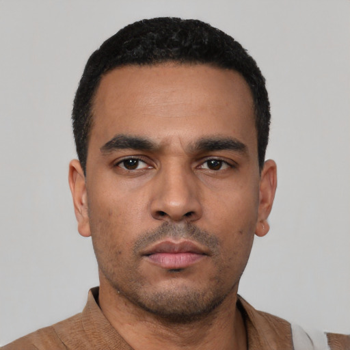 Neutral latino young-adult male with short  black hair and brown eyes