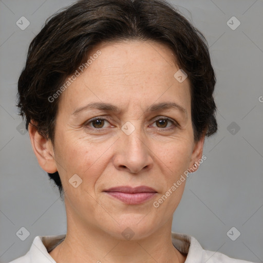 Joyful white adult female with short  brown hair and brown eyes