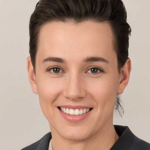 Joyful white young-adult female with short  brown hair and brown eyes