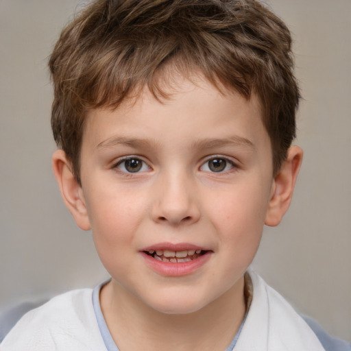 Joyful white child male with short  brown hair and brown eyes