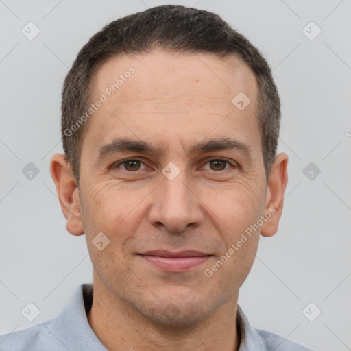 Joyful white adult male with short  brown hair and brown eyes