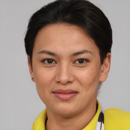 Joyful asian young-adult female with short  brown hair and brown eyes