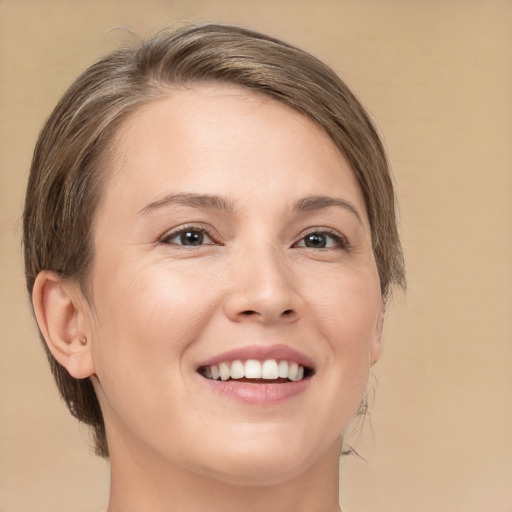 Joyful white young-adult female with medium  brown hair and brown eyes