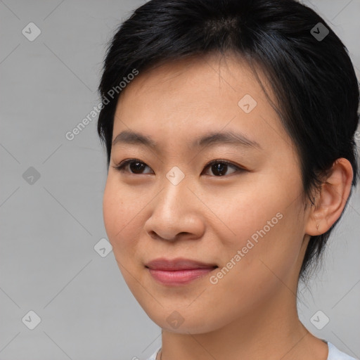 Joyful asian young-adult female with medium  brown hair and brown eyes