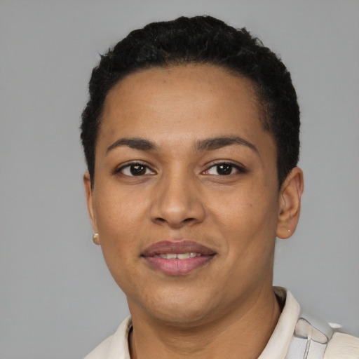 Joyful latino young-adult female with short  black hair and brown eyes
