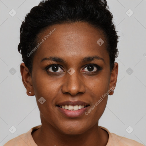 Joyful black young-adult female with short  black hair and brown eyes