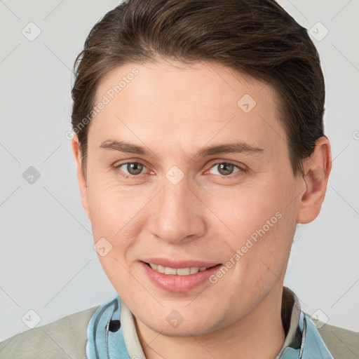 Joyful white young-adult female with short  brown hair and grey eyes