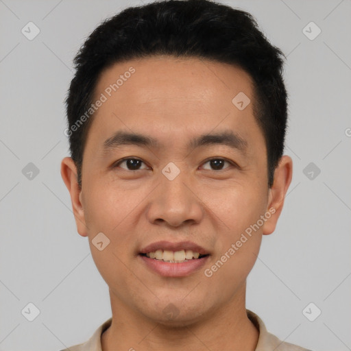 Joyful latino young-adult male with short  black hair and brown eyes