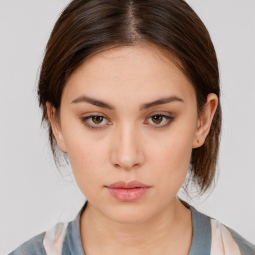 Neutral white young-adult female with medium  brown hair and brown eyes