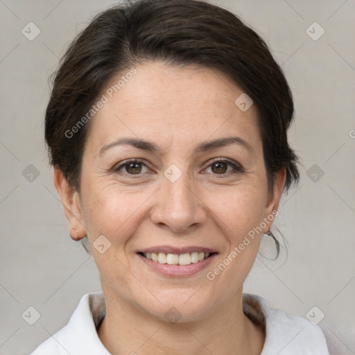 Joyful white adult female with short  brown hair and brown eyes