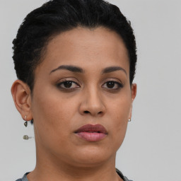 Neutral latino young-adult female with short  brown hair and brown eyes