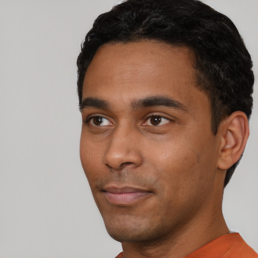 Neutral black young-adult male with short  black hair and brown eyes