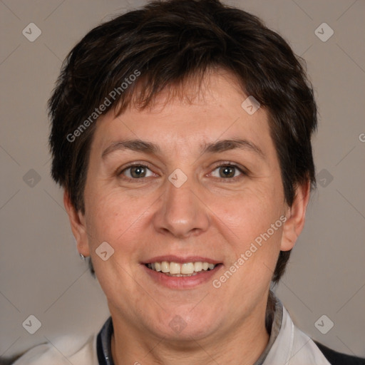 Joyful white adult female with short  brown hair and brown eyes