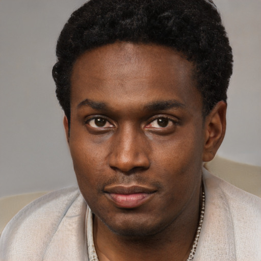 Neutral black young-adult male with short  black hair and brown eyes
