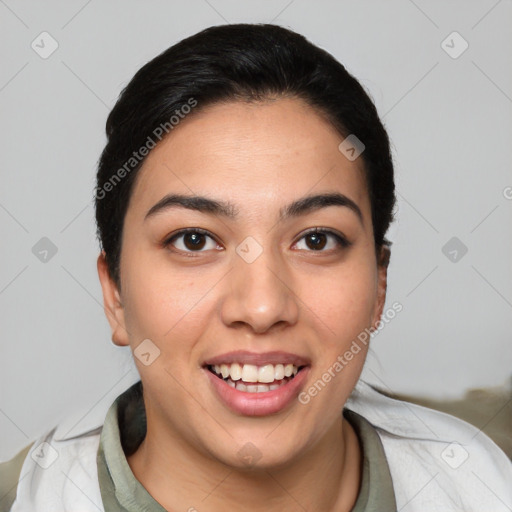 Joyful latino young-adult female with short  black hair and brown eyes