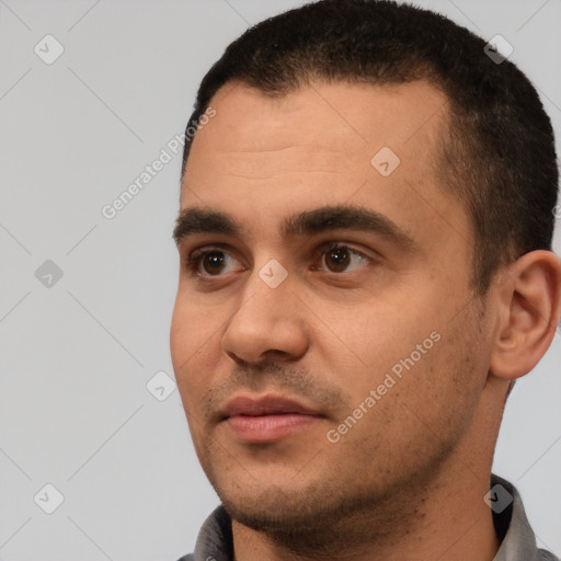 Joyful white young-adult male with short  black hair and brown eyes