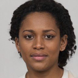 Neutral black young-adult female with short  brown hair and brown eyes