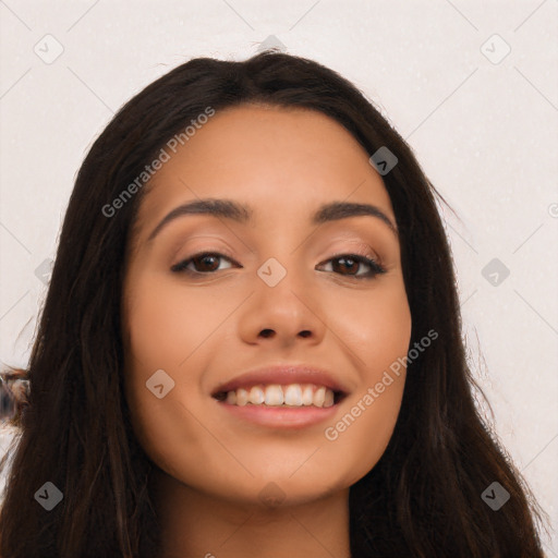 Joyful latino young-adult female with long  black hair and brown eyes