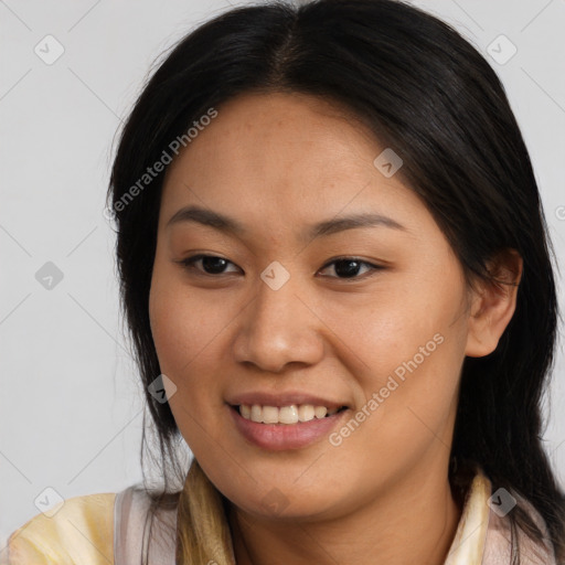 Joyful asian young-adult female with long  brown hair and brown eyes