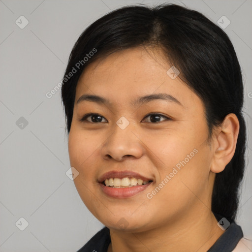 Joyful asian young-adult female with medium  black hair and brown eyes