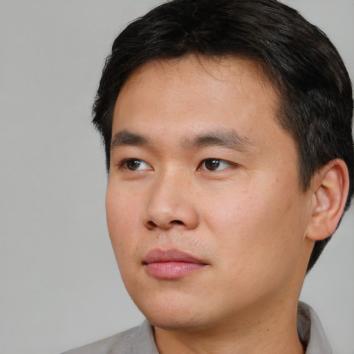 Neutral asian young-adult male with short  black hair and brown eyes
