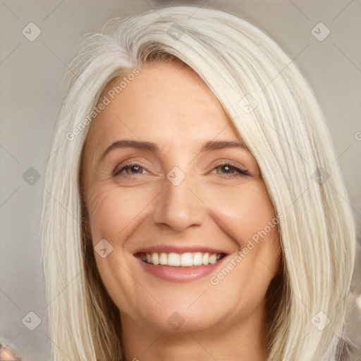 Joyful white young-adult female with long  brown hair and blue eyes