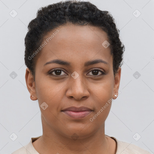 Joyful black young-adult female with short  brown hair and brown eyes